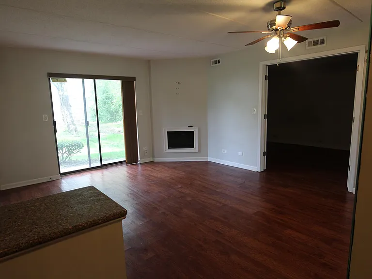View from kitchen. Double doors to bedroom.