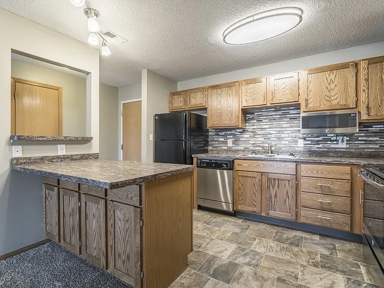 Our renovated kitchens are designed to impress with updated cabinetry, sleek countertops, stainless steel appliances, and a modern tile backsplash that brings it all together.