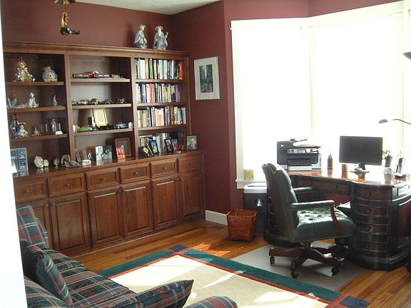 Den with full wall of custom cherrywood built-ins
