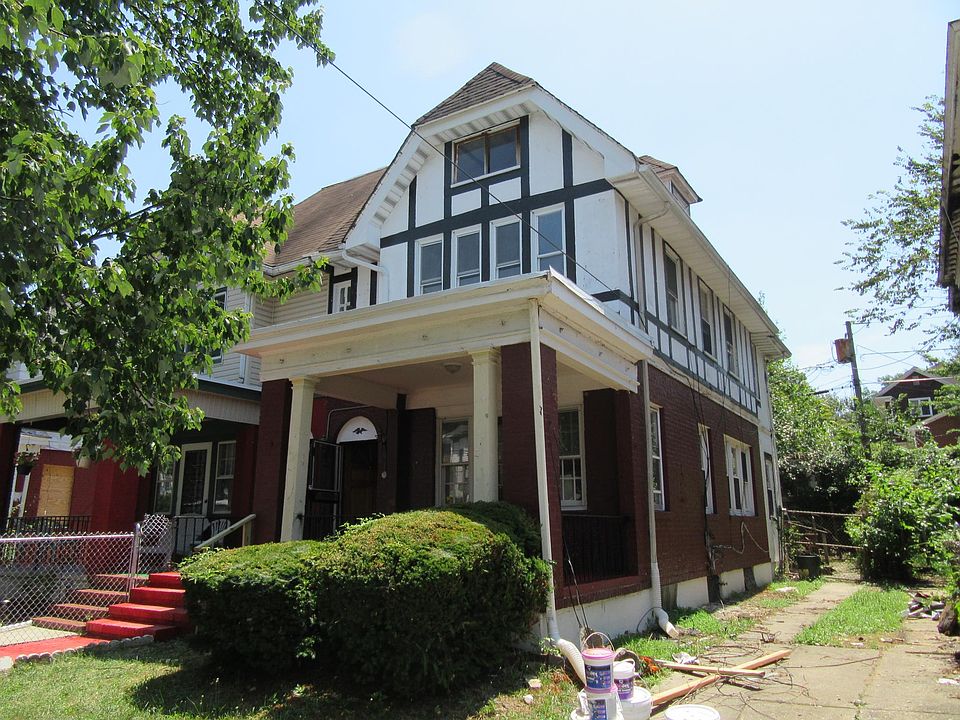 Front of house with covered porchj