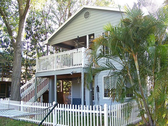 Rear fenced area and porches