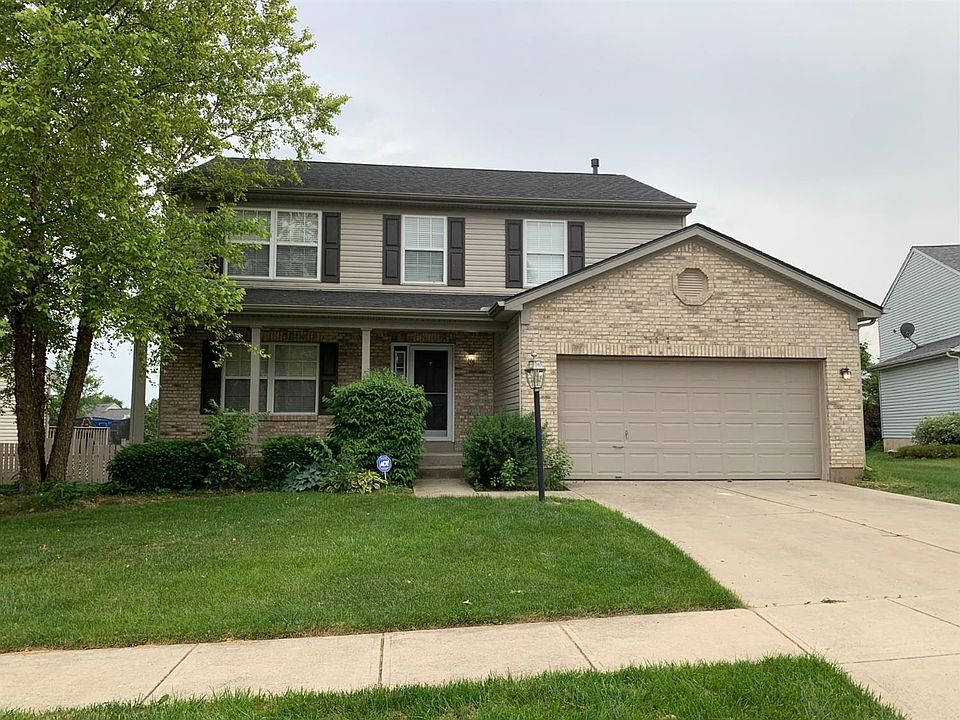 The Front of the Home and a nice porch with a 2 car garage