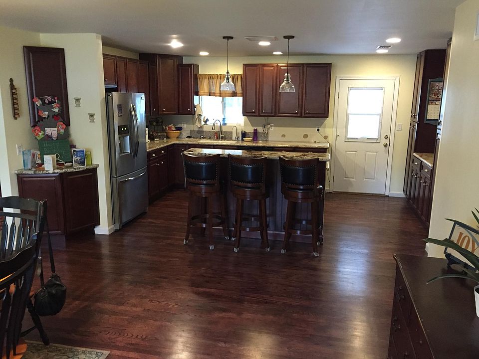 Kitchen with 2 bar stools at island