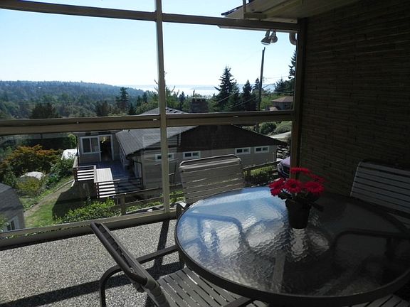 A window wall and roof allow you to enjoy the view from the deck in any weather.