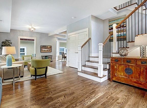 Beautiful entrance with oak floors open to dining room and kitch