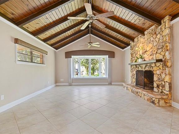 Family Room with vaulted ceilings and stone fireplace