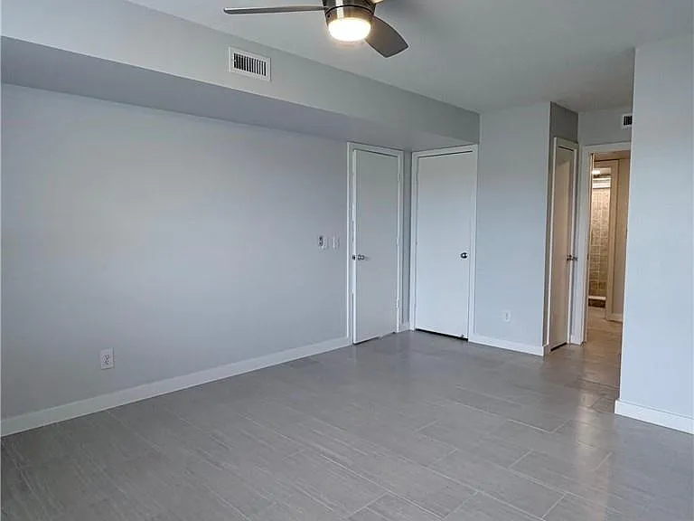 Other side of HUGE bedroom w/ a HUGE walk-in closet + an extra storage closet & a linen closet!