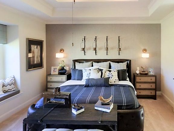 Tucked into a back corner of the first floor for added privacy, the owner s suite boasts a tiered tr