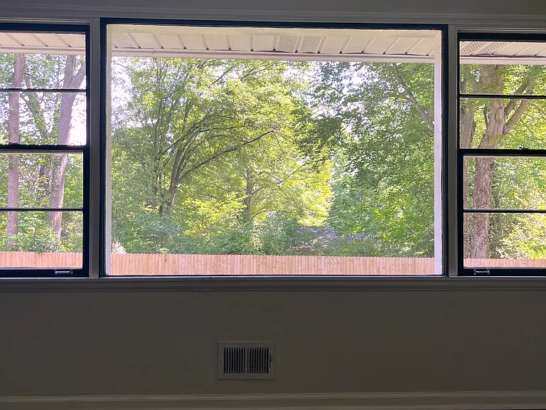 Stunning picture window overlooking huge backyard and the beautiful foliage of the Medlock Park neighborhood
