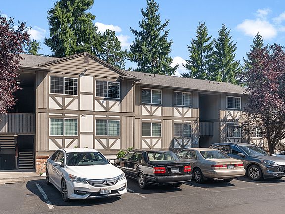 Enjoy charming Tudor-style architecture with convenient on-site parking at Abbey Lane Apartments