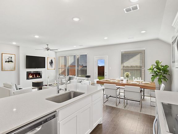 Open living space in in the Nobel home plan by Trophy Signature Homes - REPRESENTATIVE PHOTO