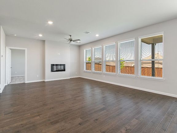 Living room in the Ryder home plan by Trophy Signature Homes - REPRESENTATIVE PHOTO