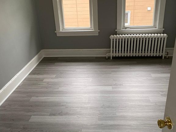 Large oversized bedroom with large windows.