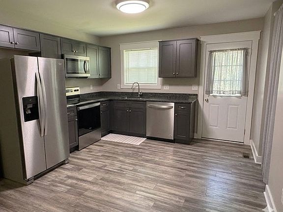 Modern kitchen with granite countertops and stainless steel appliances