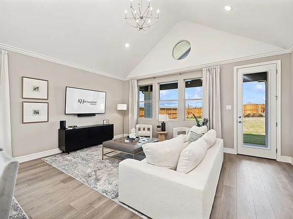 Great room with vaulted ceiling and chandeliers