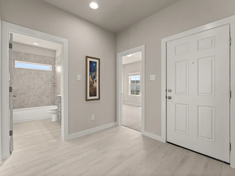 The second bathroom is located adjacent to the 2nd and 3rd bedrooms.