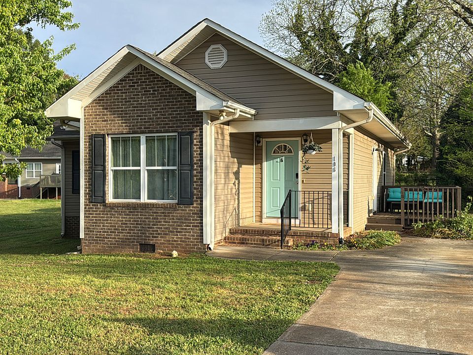 View of exterior of house from end of driveway.