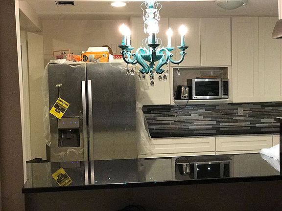 Kitchen opens into Living rm