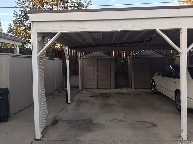 1 assigned carport space with 1 assigned storage shed