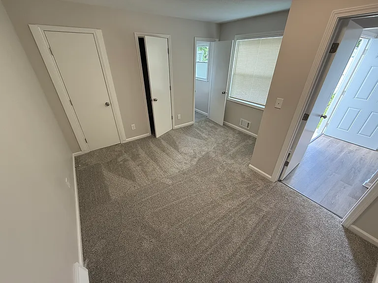 Primary Bedroom with half bath