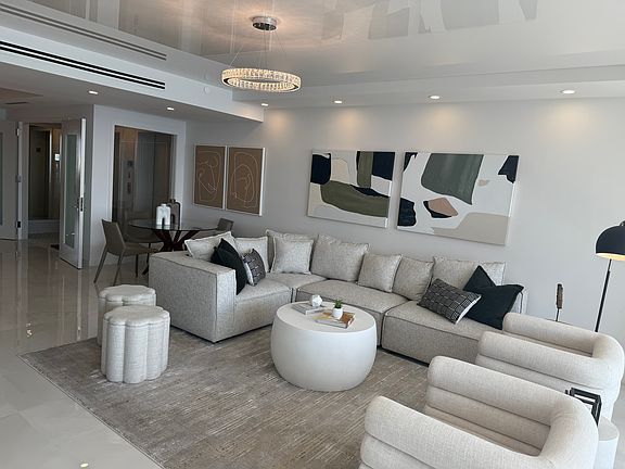 Living Room With Shiny Ceiling Reflecting the Ocean