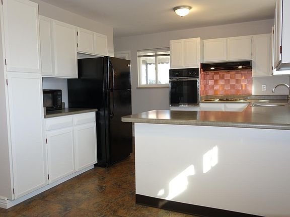 Kitchen with bar and new refrigerator