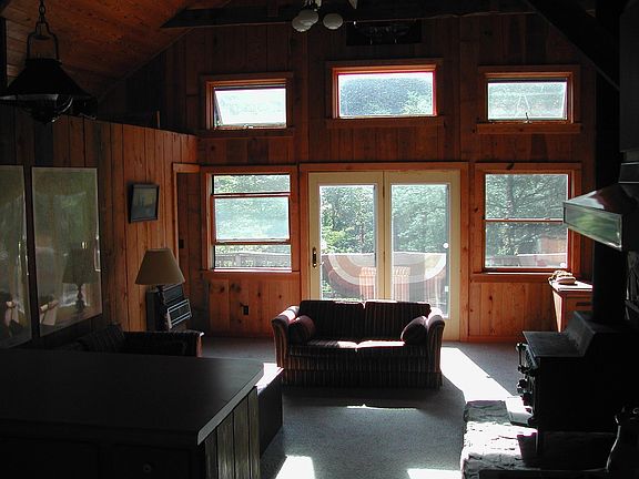 Living room facing 12 x 40 deck w/ mtn view.