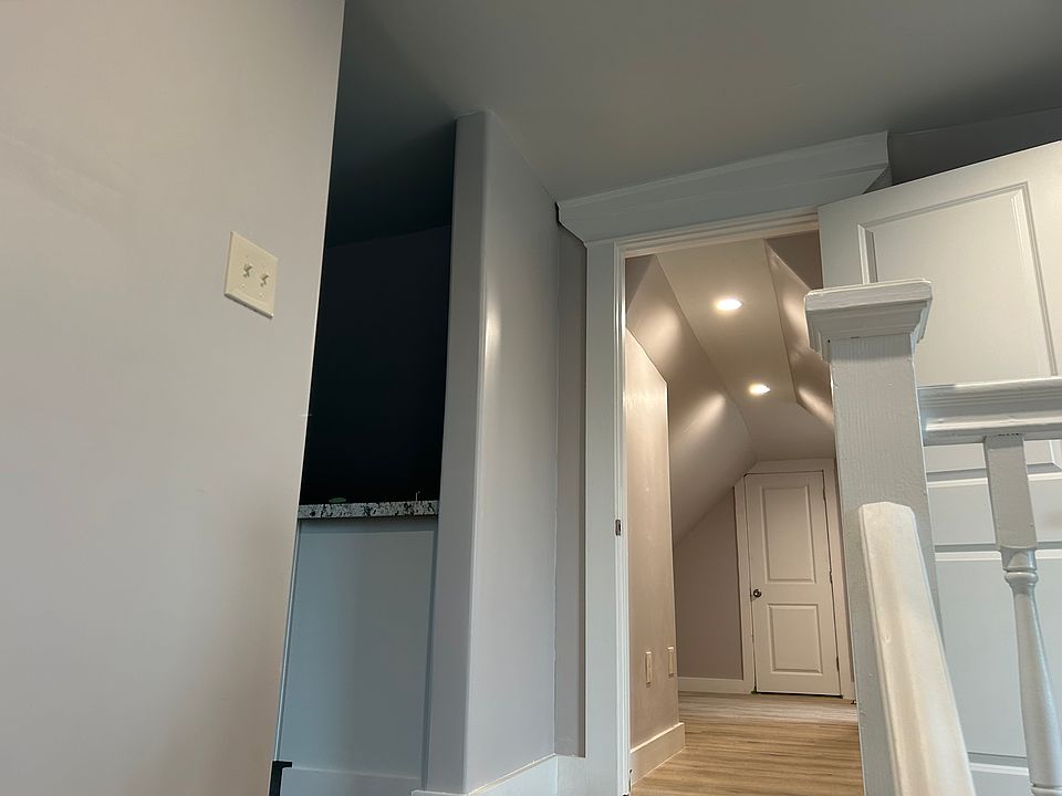 Living room looking into bath and kitchen