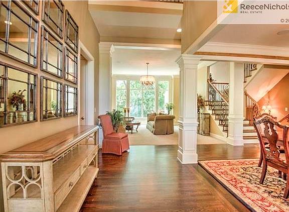 Step inside to gleaming rich hardwood floors in the entry and into the Dining Room and all the way thru the Kitchen and Hearth Room areas.