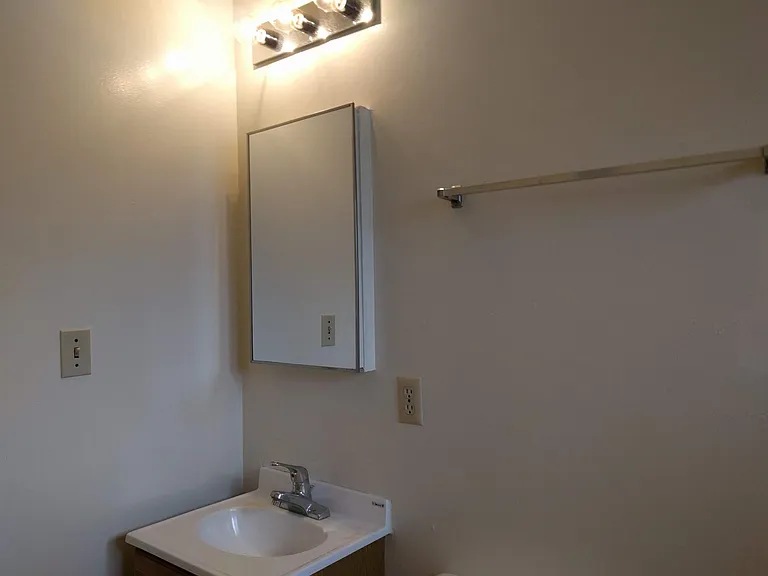 Bathroom with sink and cabinet, Lots of light.