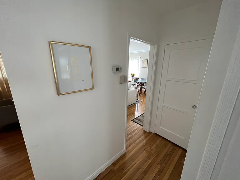 Current tenant _ hall in front of bathroom (right) and bedroom two (left) facing out to living room (right) and bedroom one (left)