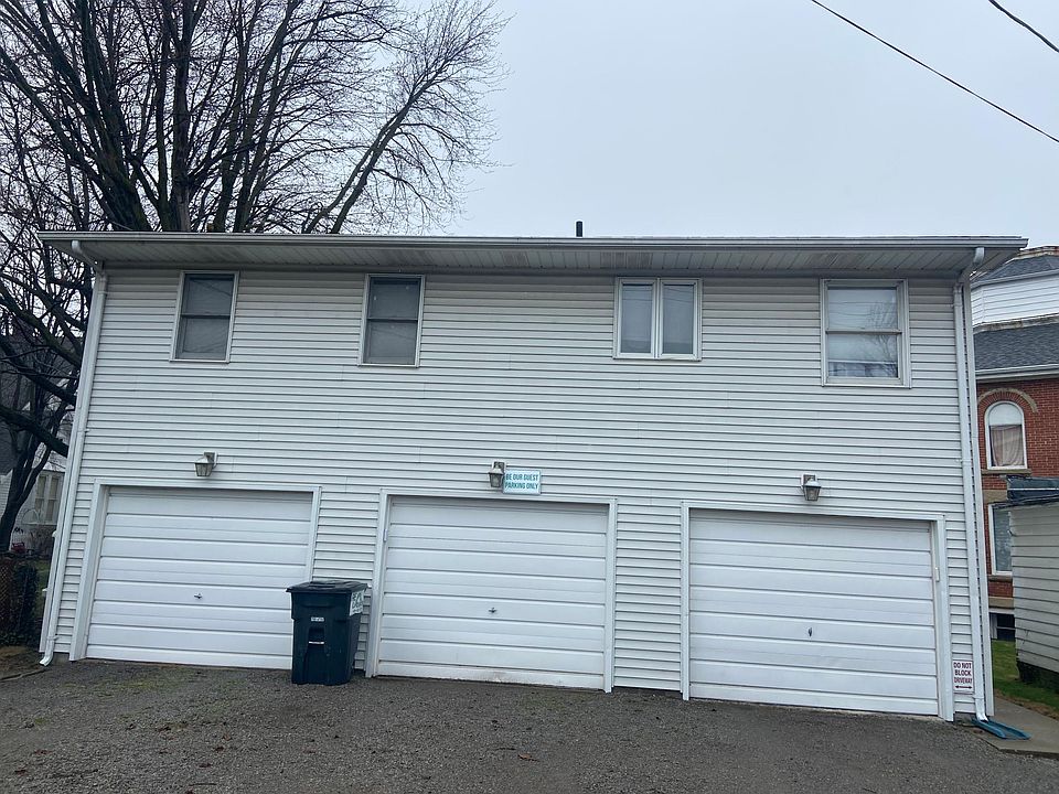 Right garage door has interior door to apartment. Garage is large with storage and opener.