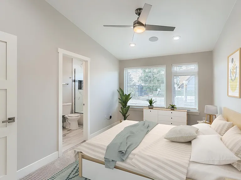 Bedroom 2. This image shows a virtually furnished space. Bedrooms come unfurnished. This room has a walk-in closet and private bathroom.