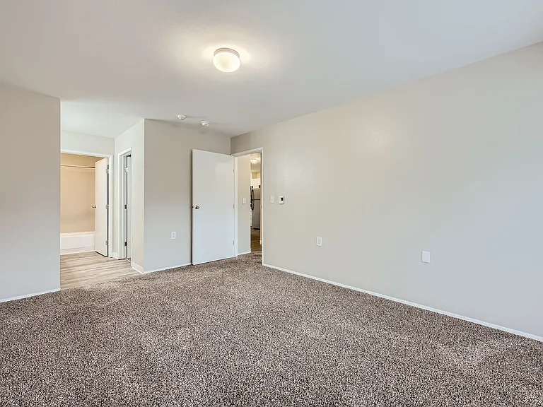 Primary bedroom in a two-bedroom two-bath apartment at Capitol City in Lacey, WA