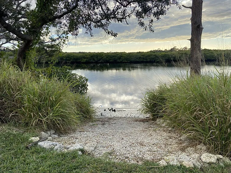 Community kayak and paddle board launch located at playground park area