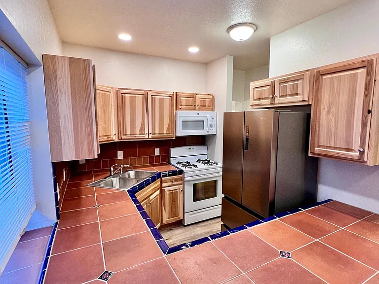 view of new kitchen across new custom countertop