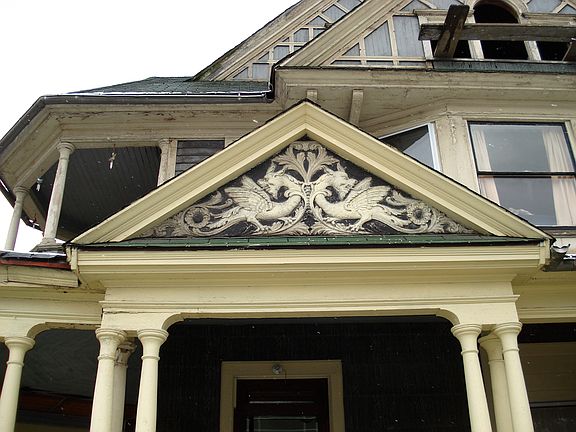 This pediment features dragons and florals