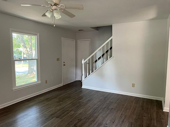 Living room with stairs to 2 large bedrooms and 2nd bath