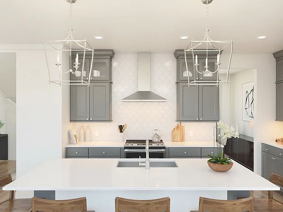 Kitchen with pendant lighting and hexagonal backsplash