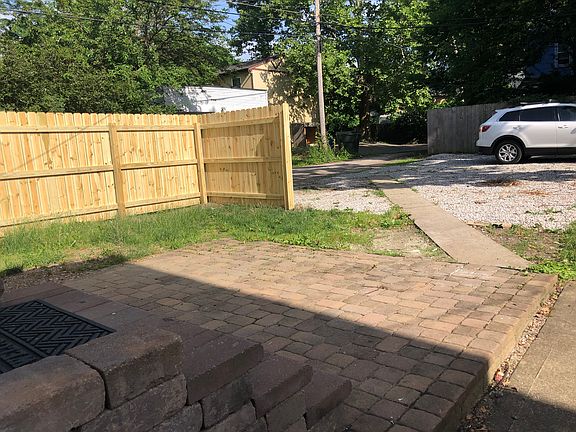 The back paver patio is screened with a privacy fence and offers space for grilling out or just enjoying the outdoor space. There are four dedicated off street parking spaces! No need to compete for street parking!