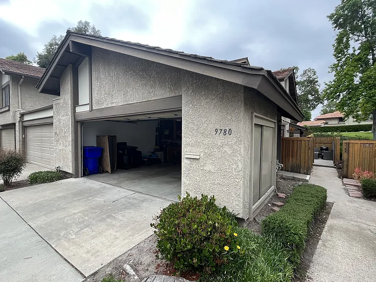 Detached 2 car garage with lots of storage capacity and built in work bench.