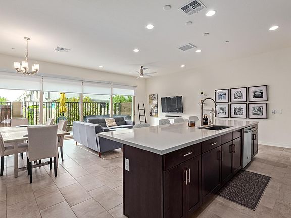Upgraded kitchen with large island, stainless steel appliances and granite countertops
