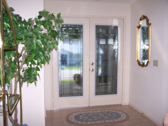 Beveled Glass Entry Doors Into Foyer