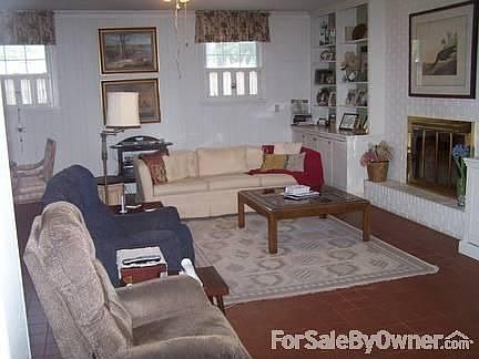 Great Room
						:
						great room has lots of built in shelves & french doors overlooking garden/patio