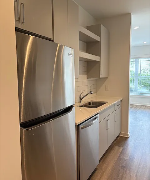 Galley style kitchen with open and closed storage