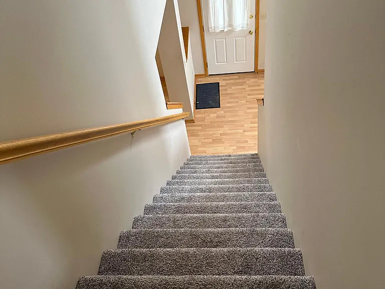 stairs to upper level and front door