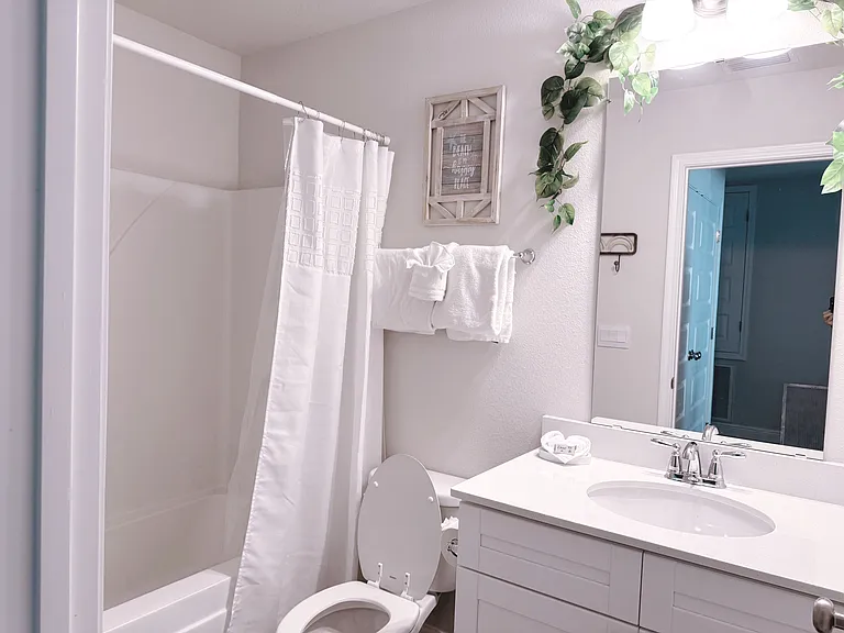 Hallway bathroom with the tub