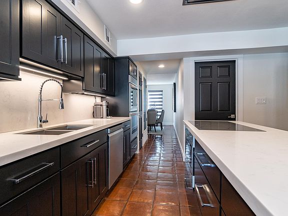 Large kitchen with tons of storage, including a walk-in pantry and separate utility closet.