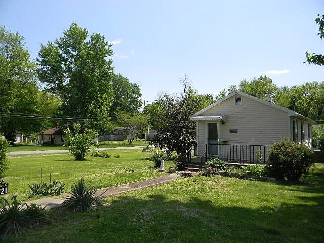 Vinyl sided home on corner lot.