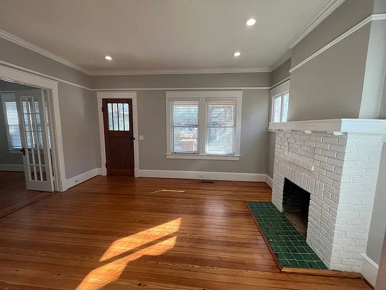 Living room with view of bonus room on the left. Lots of natural light.